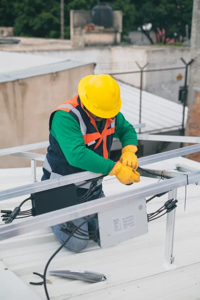 Technician installing a solar panel